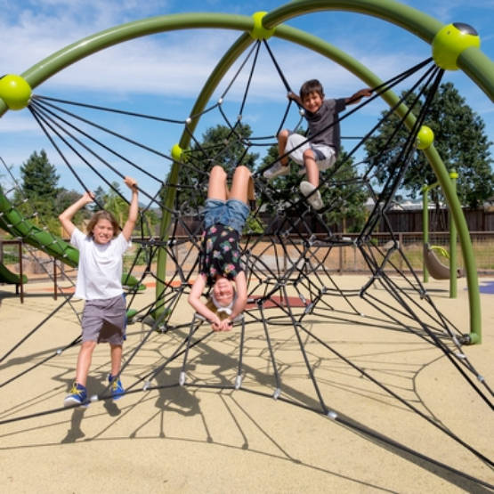 Three chlidren on climbing equipment at Bayer Park