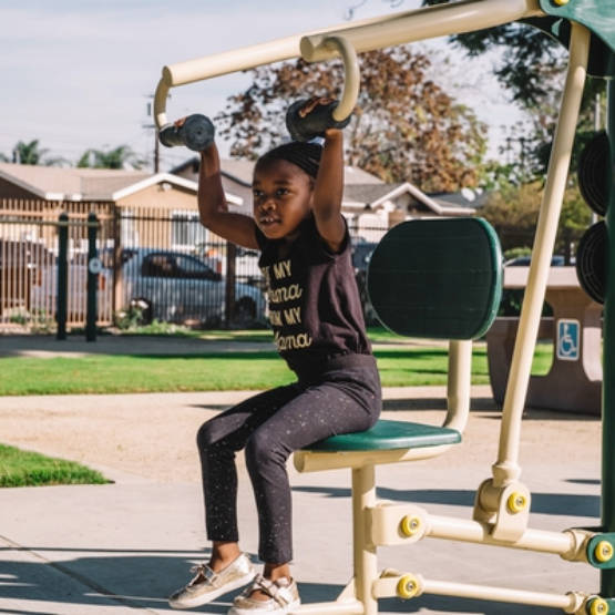 Jacaranda Park with child on exercise equipment