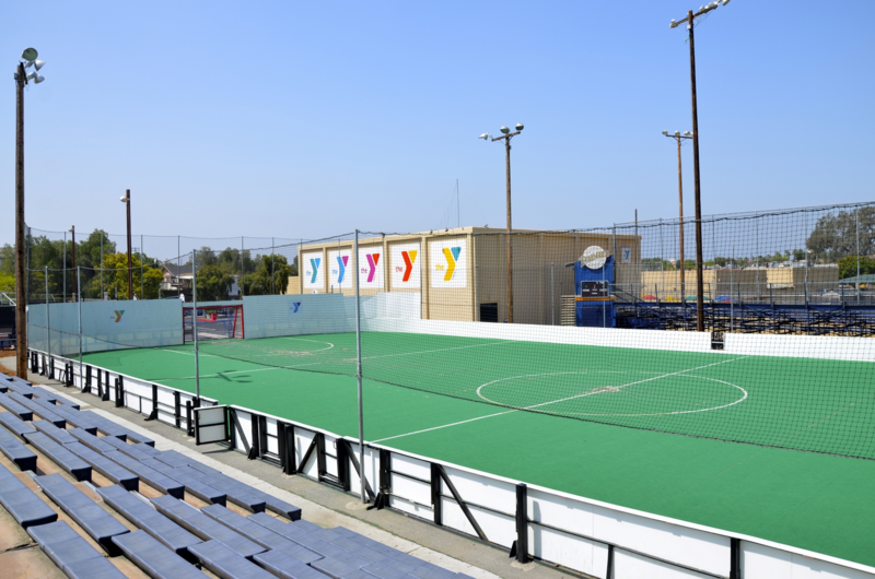 Outside soccer field with bleachers at each of it's long sides'