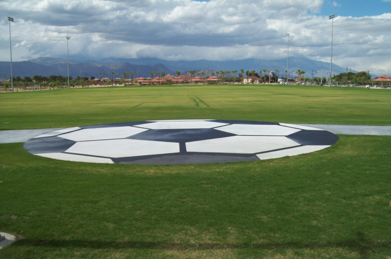 Soccer field with big soccer ball illustration on the field.